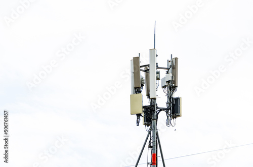Telecommunication tower of 5G and 5G cellular. Macro Base Station. 6G radio network telecommunication equipment with radio modules and smart antennas mounted on a metal