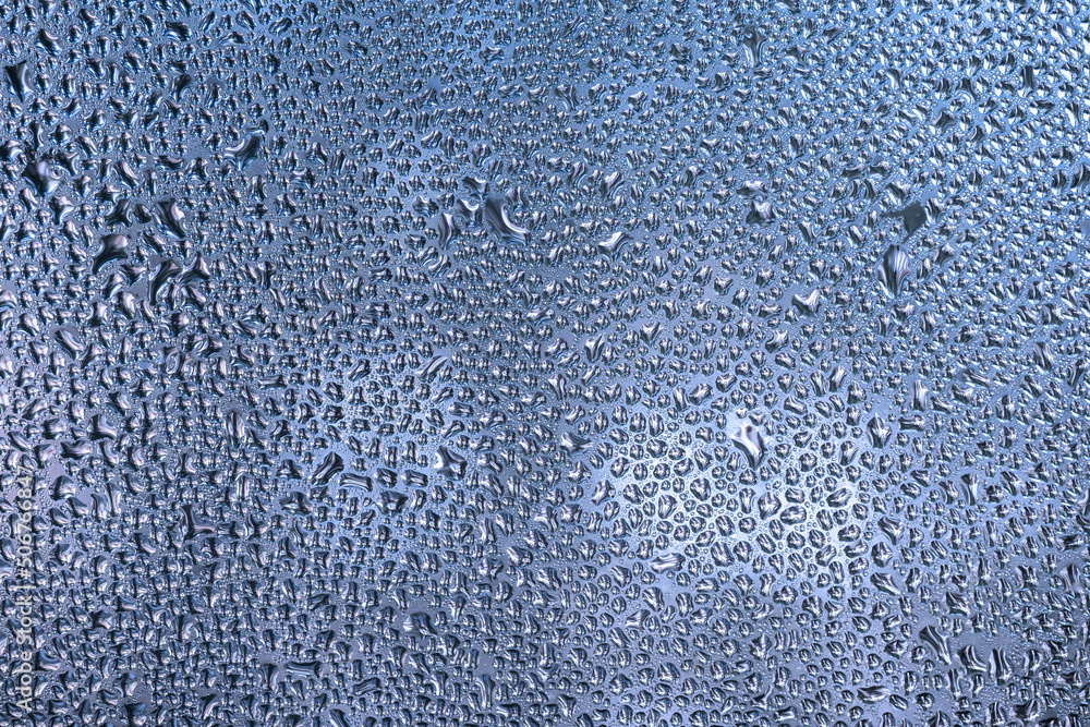 Wet glass texture, sweaty window. Abstract blue background. Wet glass texture, sweaty window. Abstract blue background.
