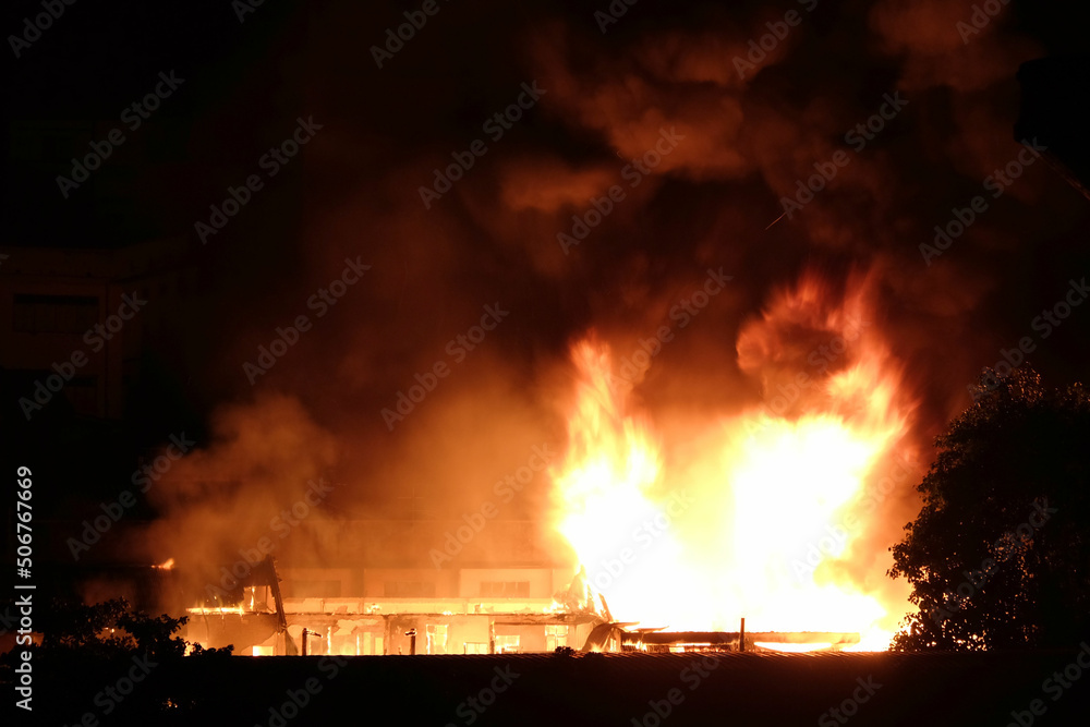 View aerial photo House fire burns during night time View aerial photo House fire burns during night time