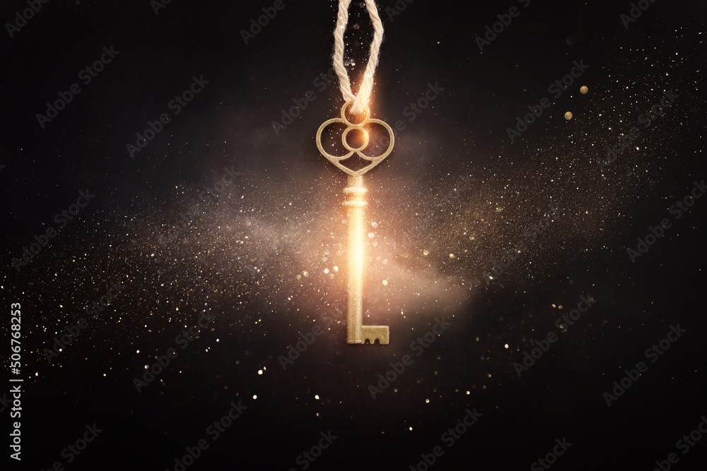Golden key with glowing lights and dark background, wisdom, wealth, and spiritual concept - obrazy, fototapety, plakaty 