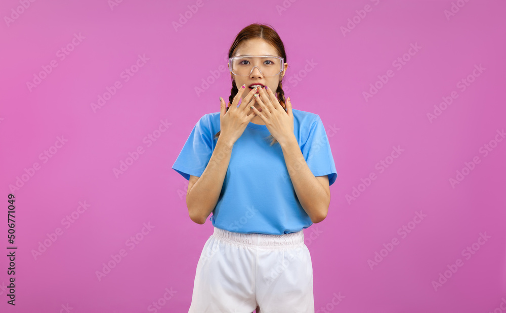 Portrait of young asian woman looking at camera with face expression feeling surprised isolated on pink background, advertising promotion concept Portrait of young asian woman looking at camera with face expression feeling surprised isolated on pink background, advertising promotion concept