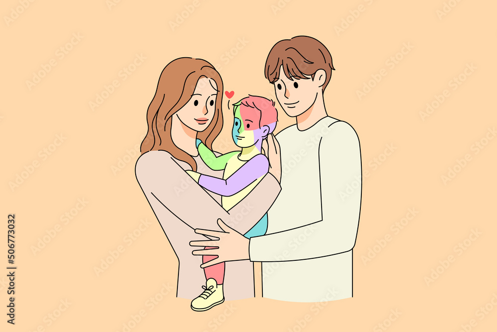 Parents hug small child with autism Parents hug small child with autism