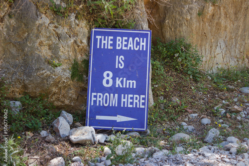 The beach is 8 klm from here sign