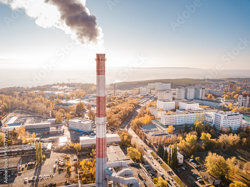 Leinwand Poster smoking chimney and pipe of a thermal power plant