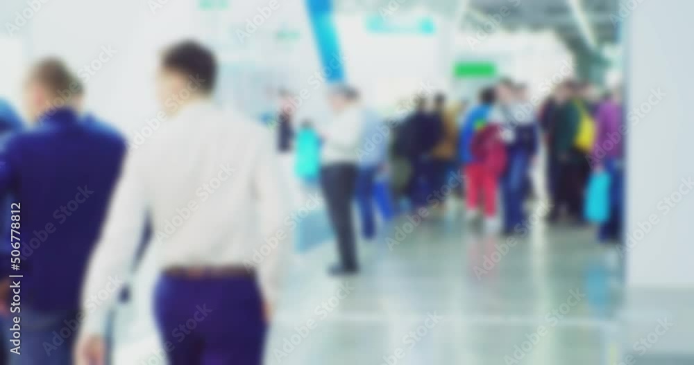 modern business life. defocused blurry video. background on the theme of business. blurred silhouettes of unrecognizable people walking in a large hall. modern business life. defocused blurry video. background on the theme of business. blurred silhouettes of unrecognizable people walking in a large hall.