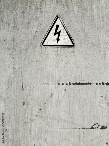 sticker of a sign of attention on a metal door or panel