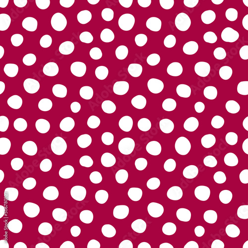 White spots seamless pattern with burgundy background.