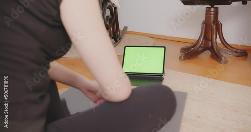 Exercising at home online yoga matress interior physical health Greenscreen Laptop Tablet watching 