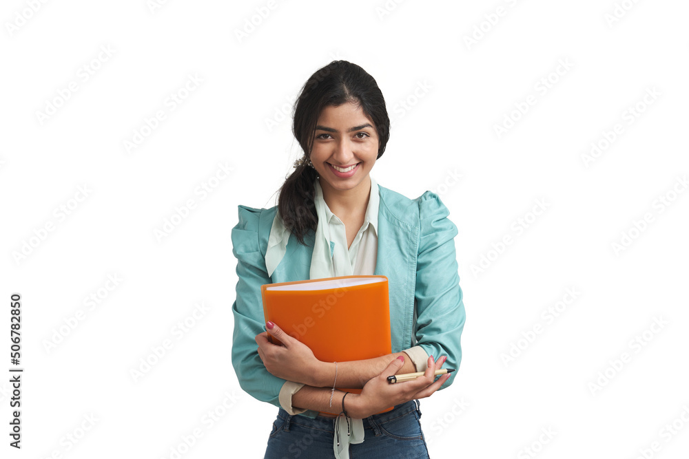 Young Venezuelan businesswoman smiling and looking at camera with a folder. Isolated over white background. Young Venezuelan businesswoman smiling and looking at camera with a folder. Isolated over white background.