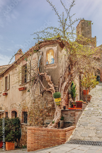 Narrow medieval lanes of Castiglione della Pescaia, an old village on the Tuscan coast photo