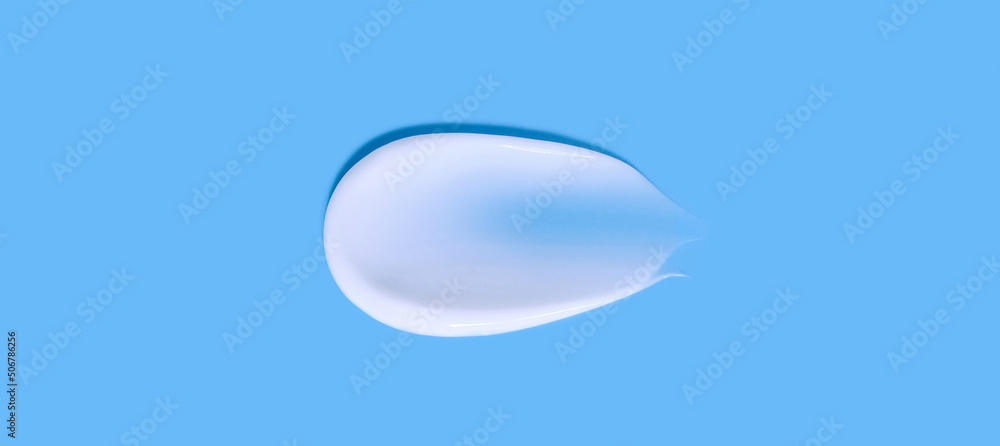 cosmetic smear cream texture on blue background
cosmetic smear cream texture on blue background