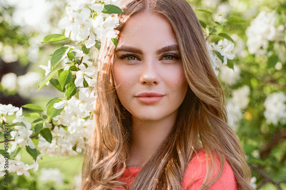Beautiful young woman in summer garden. Beauty summertime. Film photography Beautiful young woman in summer garden. Beauty summertime. Film photography