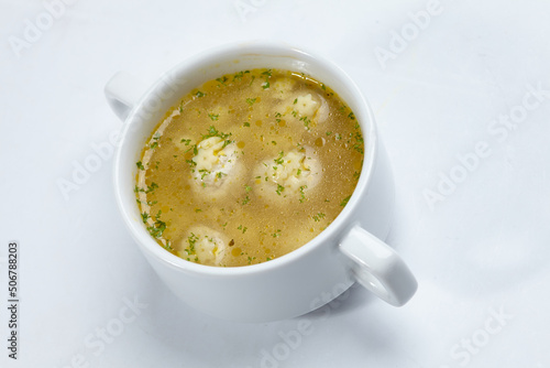 soup with meatballs on white