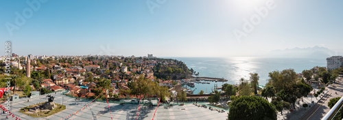 Panoramic view of Antalya old town harbor, modern city and Taurus Mountains