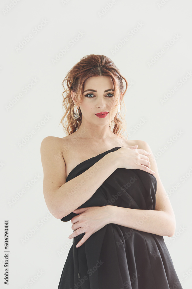 young woman posing in jacket and lingerie. Girl in a jacket, pants and sexy lingerie posing in a studio young woman posing in jacket and lingerie. Girl in a jacket, pants and sexy lingerie posing in a studio