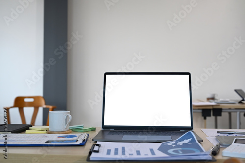 Wallpaper Mural Wooden office desk with computer laptop, coffee cup and financial document Torontodigital.ca