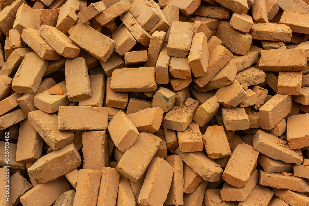 Solid clay brick used for construction. Background, brown red color Solid clay brick used for construction. Background, brown red color