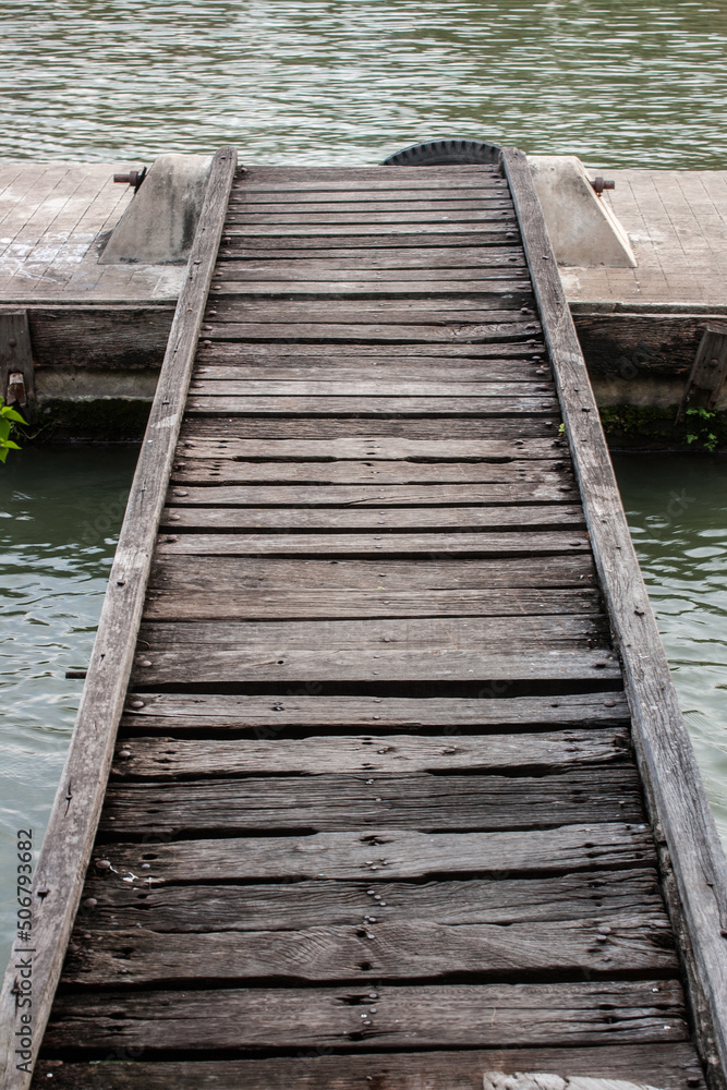 Fototapeta premium Wooden pier into the canal