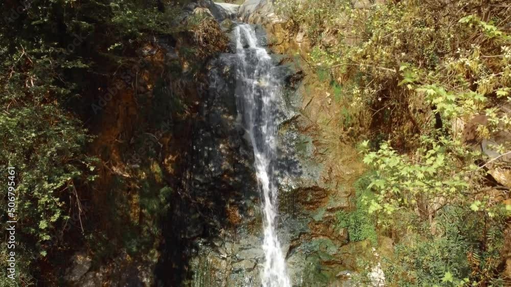 Beautiful waterfall on green mossy rocks. Water stream flowing in rocky path among wild forest. Wild mountain waterfall landscape. Wild waterfall rocks. High quality 4k footage Beautiful waterfall on green mossy rocks. Water stream flowing in rocky path among wild forest. Wild mountain waterfall landscape. Wild waterfall rocks. High quality 4k footage