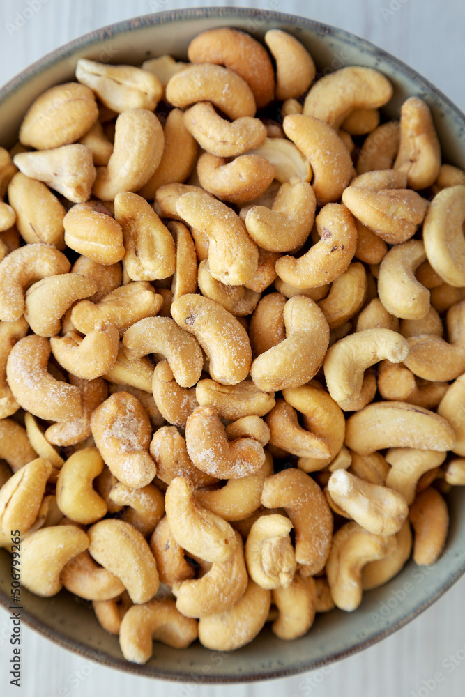 Homemade Roasted and Salted Cashews in a Bowl, top view. Flat lay, overhead, from above. Homemade Roasted and Salted Cashews in a Bowl, top view. Flat lay, overhead, from above.
