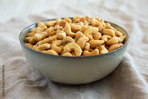 Homemade Roasted and Salted Cashews in a Bowl, low angle view. Close-up.