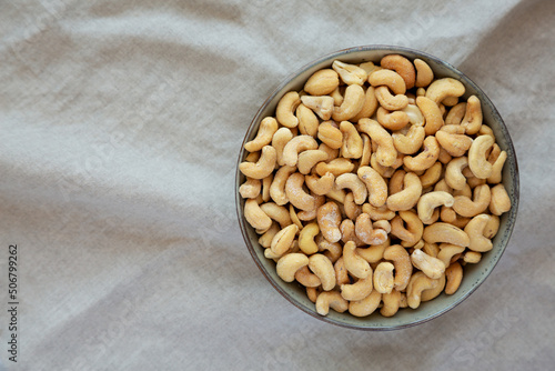 Homemade Roasted and Salted Cashews in a Bowl, top view. Flat lay, overhead, from above. Copy space.