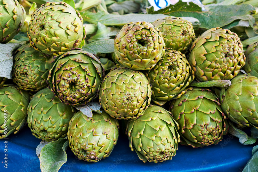 Fototapeta premium Fresh green artichokes on the farmers market stall