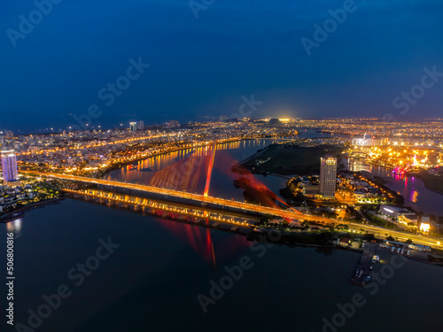 Aerial view of Da Nang dragon bridge at night. © Kien