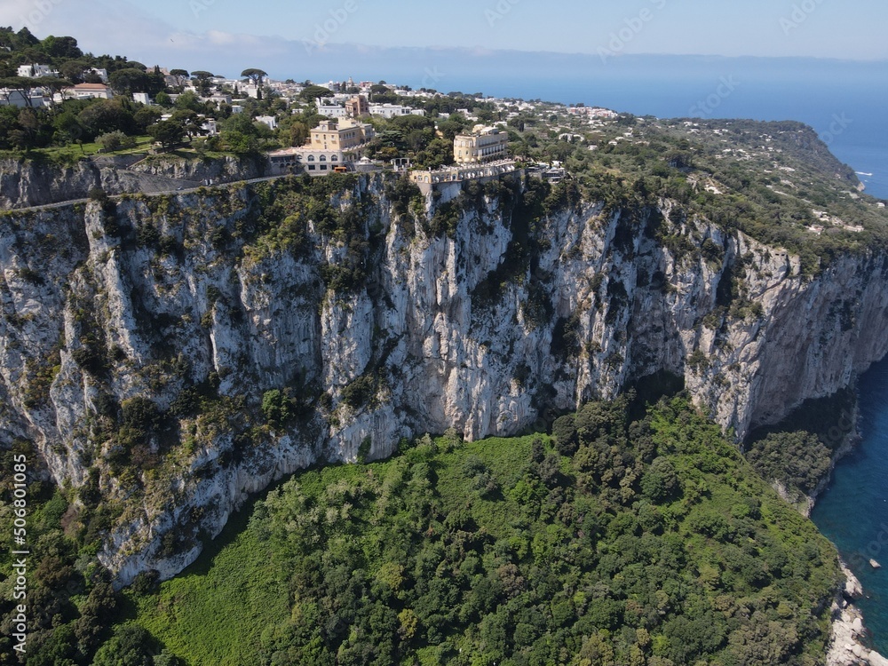 Fototapeta premium Aerial view of Marina Grande in Capri, an island located in the Tyrrhenian Sea off the Sorrento Peninsula, on the south side of the Gulf of Naples in the Campania region of Italy. Drone view of Capri.