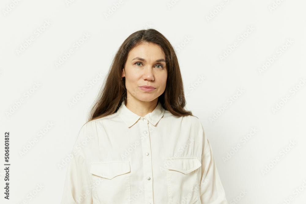 portrait of a beautiful happy attractive adult woman in a white shirt on a white background portrait of a beautiful happy attractive adult woman in a white shirt on a white background