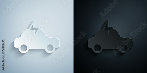 Paper cut Electric car and electrical cable plug charging icon isolated on grey and black background. Renewable eco technologies. Paper art style. Vector