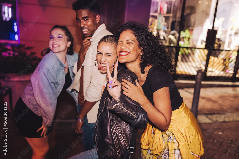 Group of vibrant friends having a good time outdoors Group of vibrant friends having a good time outdoors