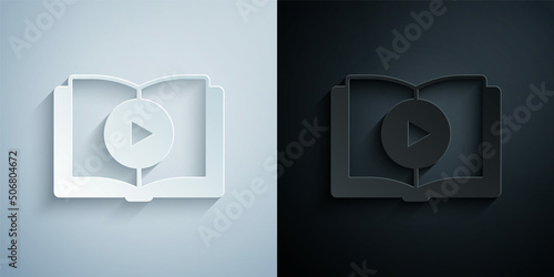 Paper cut Audio book icon isolated on grey and black background. Play button and book. Audio guide sign. Online learning concept. Paper art style. Vector