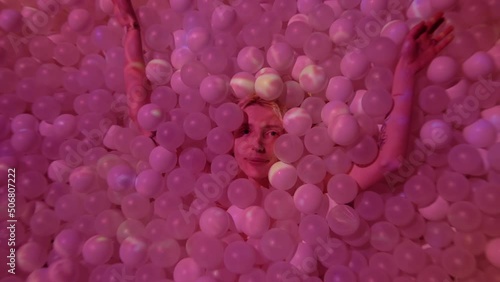 Wallpaper Mural Young woman playing with balls in a dry pool spotlight with abstract art digital Torontodigital.ca