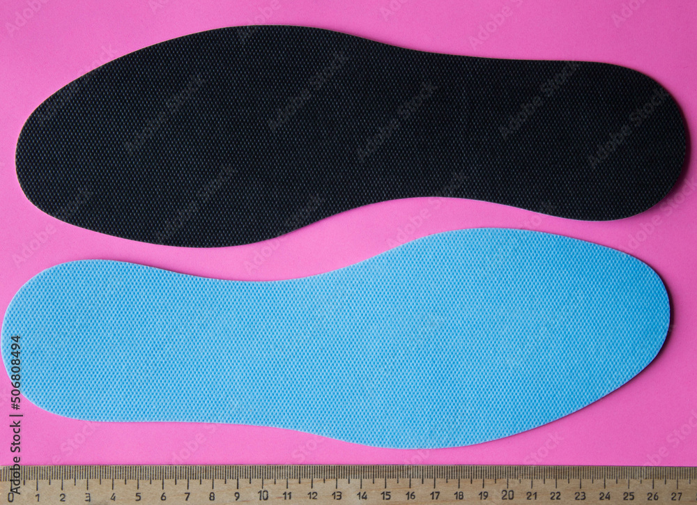 Blue insoles for shoes with ruler. Top view. Blue insoles for shoes with ruler. Top view.