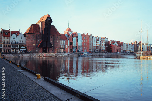 Famous historic Medieval port Crane (Żuraw / Krantor) - one of the Gdańsk water gates.  Morning on the Motlava River. Old town Gdansk (Gdańsk / Danzig), Poland (Polska / Polen). photo