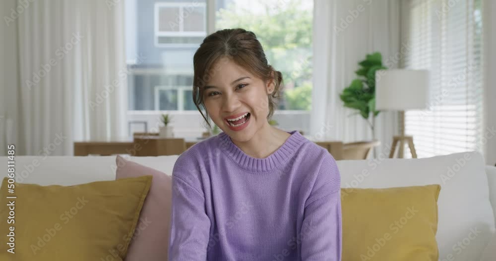 Young influencer vlogger teen girl asia people sit easy relax at cozy sofa home selfie vlog live talk share chat on social media app screen reel tiktok instagram. Model lady video call look at camera. Young influencer vlogger teen girl asia people sit easy relax at cozy sofa home selfie vlog live talk share chat on social media app screen reel tiktok instagram. Model lady video call look at camera.