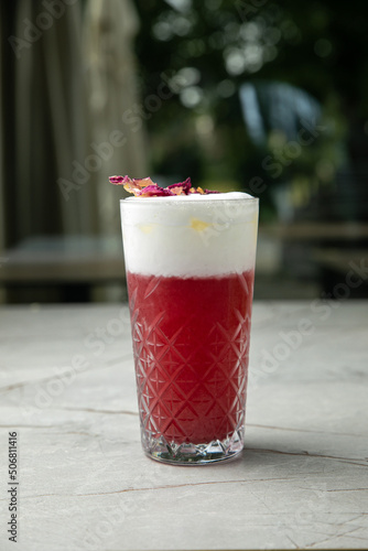 non-alcoholic refreshing cocktail in the heat, lemonade. With ice on a gray table
