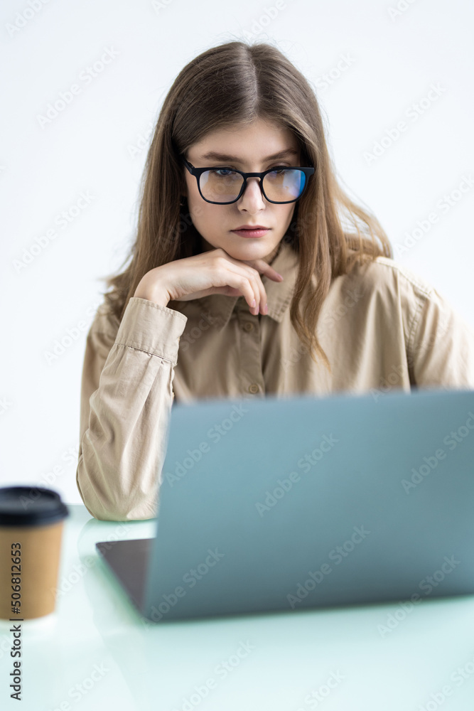 Attractive young woman working in office on laptop Attractive young woman working in office on laptop
