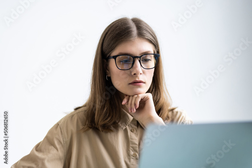 Young woman working with laptop from office