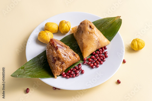 There are two rice dumplings on the plate photo