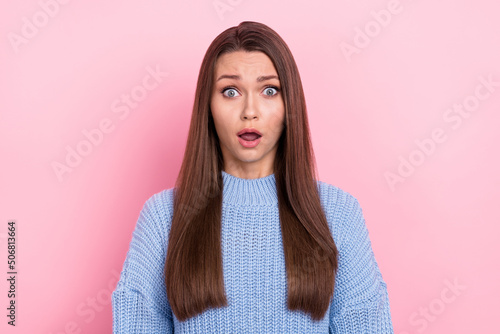 Photo of impressed millennial brown hairdo lady look wear blue pullover isolated on pink color background