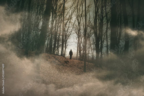 man silhouette in scary haunted forest