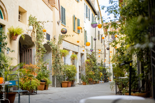 Beautifully landscaped narrow street in the old town of Grosseto  in Maremma region of Italy. Cozy city view of the old Italian town