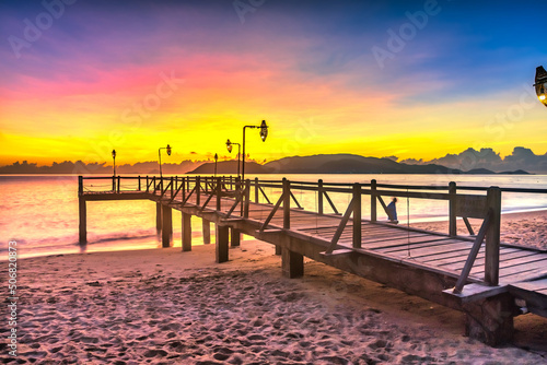 Sunrise on Wooden pier on city beach at Nha Trang  Vietnam in a summer day