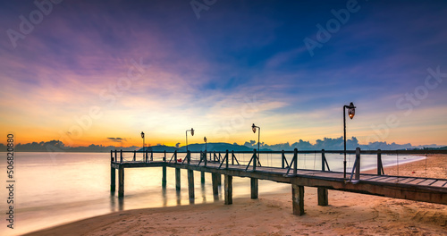 Sunrise on Wooden pier on city beach at Nha Trang  Vietnam in a summer day