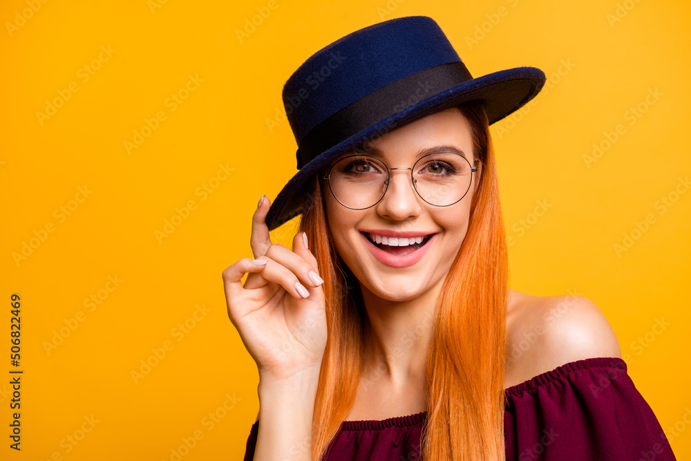 Photo of adorable pretty woman wear red outfit eyeglasses headwear empty space isolated yellow color background Photo of adorable pretty woman wear red outfit eyeglasses headwear empty space isolated yellow color background