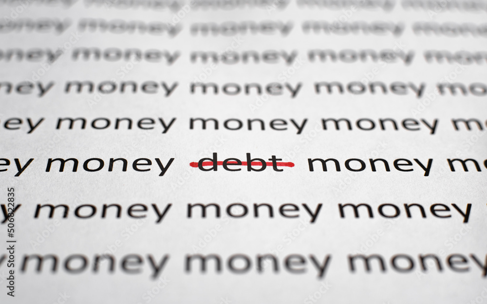 Printed text Money and Debt on white paper, close-up. Financial problems, economics and business concept. Selective focus on word debt crossed out with red line, low angle view, macro photo Printed text Money and Debt on white paper, close-up. Financial problems, economics and business concept. Selective focus on word debt crossed out with red line, low angle view, macro photo