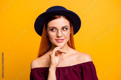 Photo of cute adorable woman wear red outfit eyewear arm chin looking empty space isolated yellow color background