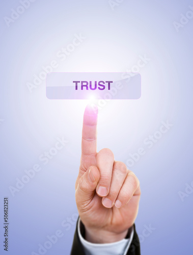 Businessman is Pushing On Trust Button Against Blue